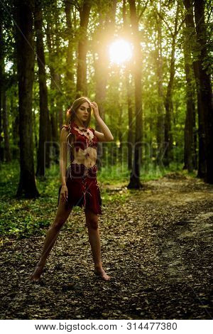 Sexy Legs. Amazon Woman. Sexy Witch. Cougar Female. Wild Woman In Forest. Sexy Girl In Leather Suede