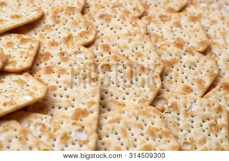 Tuc Original Snack Crackers Lies On Market Table Stacked In Big Pile