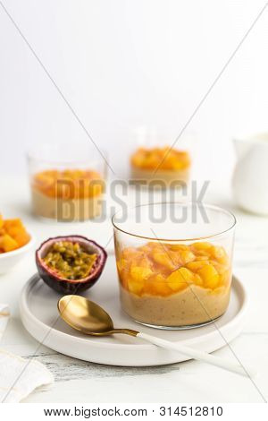 Caramel Panna Cotta, Custard Pudding With Peach And Passion Fruit, White Table, Copy Space