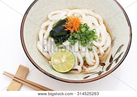 Japanese Bukkake Udon Noodles In A Ceramic Bowl On White Background
