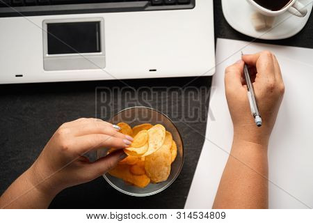 Compulsive Overeating, Mindless Snacking, Junk Food, Unhealthy Meals. Woman Eating Chips From Bowl A