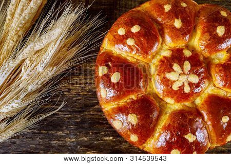 Sheaf Of Wheat And Jewish Challah On Dark Wooden Background
