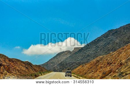 A Highway Among The Mountains In The Salalah City Of Southern Oman