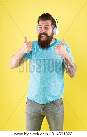 Bearded Man Listening Music Wireless Gadget. Freedom Going Wireless Offers You Is Unparalleled. Hips