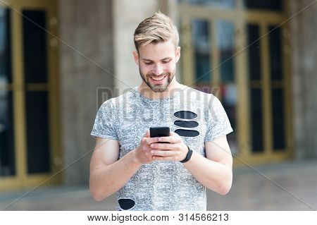 Make Your Own Blog. Handsome Man Typing New Blog Post From Smartphone. Blogger Keeping Private Blog 