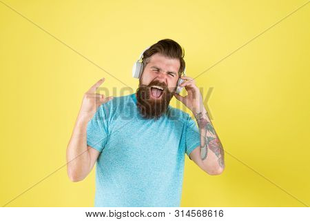Hipster Happy Using Modern Wireless Headphones. Freedom Going Wireless Offers You Is Unparalleled. M