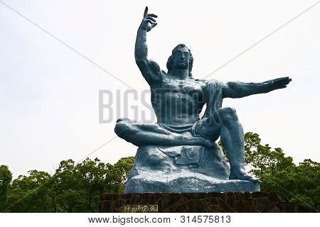 Nagasaki, Japan - 25 May 2013, Peace Park With Peace Statue. The Statue Is Commemorating The Atomic 