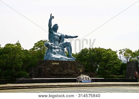 Nagasaki, Japan - 25 May 2013, Peace Park With Peace Statue. The Statue Is Commemorating The Atomic 