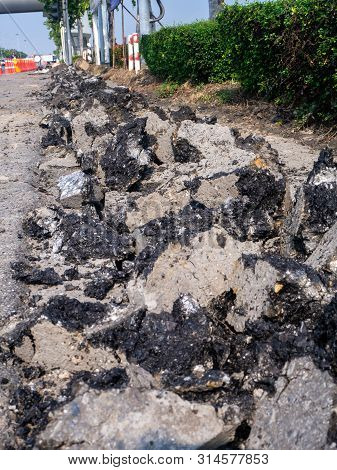 The Road Repairing Works With Jackhammer. Machine Drills Asphalt