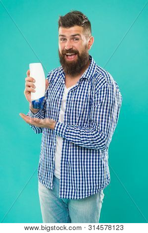 Body Care Cosmetic Bath Shower. Man Hold Shampoo Bottle. Hair Care. Shampoo For Daily Use. Skin Loti