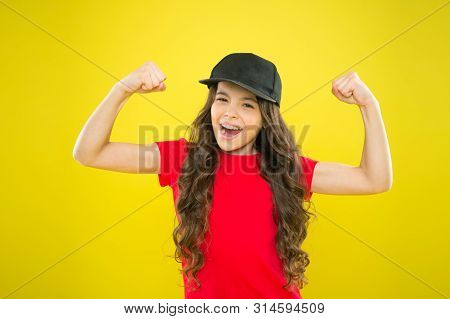 Girl Long Curly Hair Wear Cap. Must Have Street Style Accessory Trends. Modern Fashion. Kids Fashion
