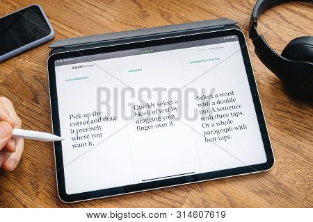 Paris, France - Jun 6, 2019: Man Reading On Apple Ipad Pro Tablet About Latest Announcement Of At Ap