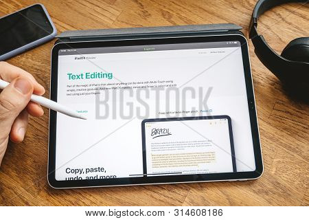 Paris, France - Jun 6, 2019: Man Reading On Apple Ipad Pro Tablet About Latest Announcement Of At Ap