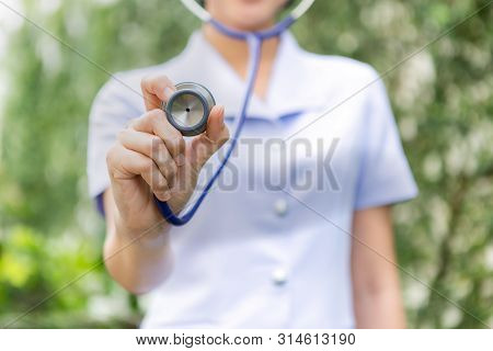 Close-up Of Nurse Using Stethoscope , Focus On Stet