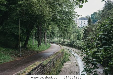 Luxembourg City, Luxembourg - May 19, 2019: Path By The Petrusse Stream Inside A Park In Luxembourg 