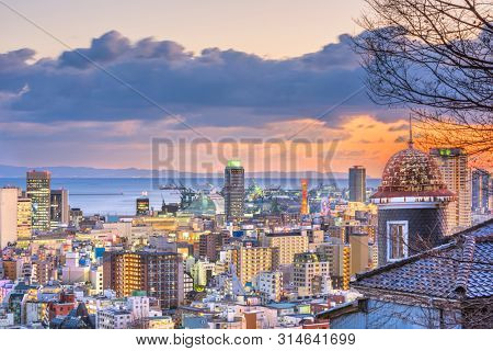 Kobe, Hyogo, Japan cityscape from historic Kitano district at dusk.