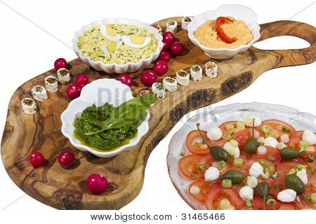 Delicius organic food on olive tree plate
