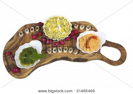 Delicius organic food on olive tree plate