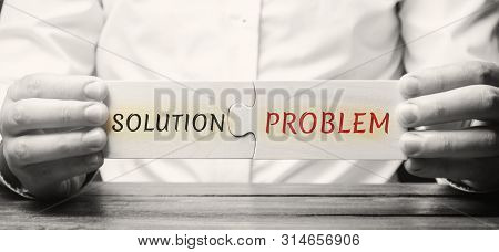 Businessman Collects Wooden Puzzles With The Word Solution Problem. A Strategy For Overcoming Busine