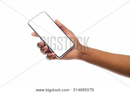 African American Womans Hand Holding Frameless Smartphone With White Screen. Isolated, Panorama With
