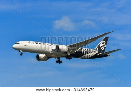 Airplane Landing At Singapore Airport