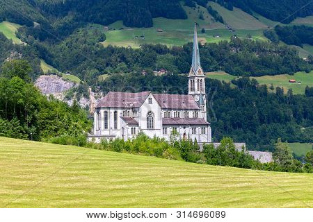 Lungern Old Stone Catholic Church In Swiss Village.