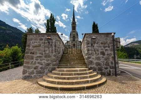Lungern Old Stone Catholic Church In Swiss Village.