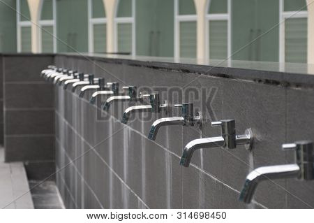 Many Taps Water Without Water In The Masjid For Muslim Playing Place.