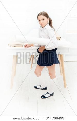 Serious About Own Project. Girl Hold Whatman Paper. Kid School Uniform Strict Face Ready With Her Pr