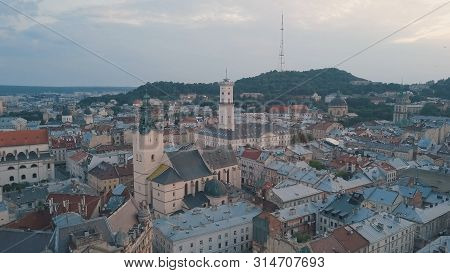 Aerial Roofs And Streets Old City Lviv, Ukraine. Central Part Of Old European City In Morning. Panor
