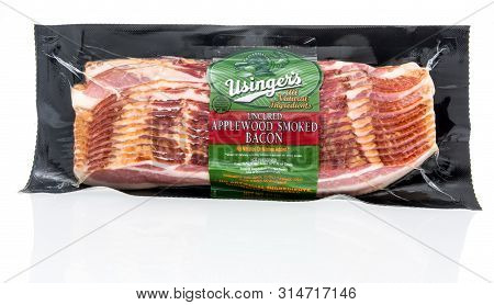 Winneconne, Wi - 21 July 2019 : A Package Of Usingers Applewood Smoked Uncured Bacon On An Isolated 