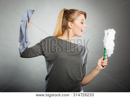 Joy Happiness Chores Cleaning Concept. Cheerful Lady With Household Items. Young Extatic Blonde Maid