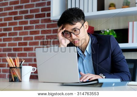 Young Asian Businessman Concentrate On Working With Laptop Computer At Office, Asian Office Man Comt