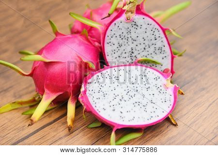 Dragon Fruit Slice On Wooden Background / Fresh Pitaya Summer Tropical Fruit Concept