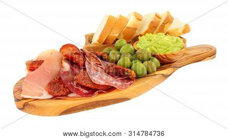 Gran Antipasto Snack Selection On An Olive Wood Serving Board With Salami, Cured Meat Slices And A B