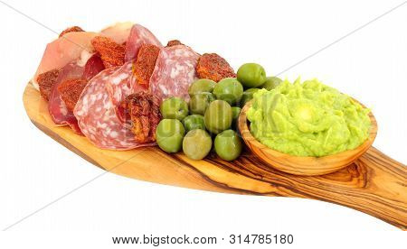 Gran Antipasto Snack Selection On An Olive Wood Serving Board With Salami, Cured Meat Slices And A B