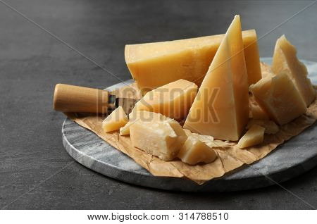 Marble Board With Delicious Cheese On Table, Closeup