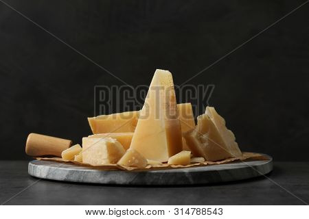 Marble Board With Delicious Cheese On Table
