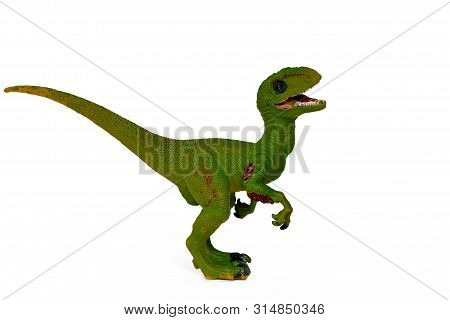 Green Toy Dinosaur Velociraptor With Open Mouth Isolate
