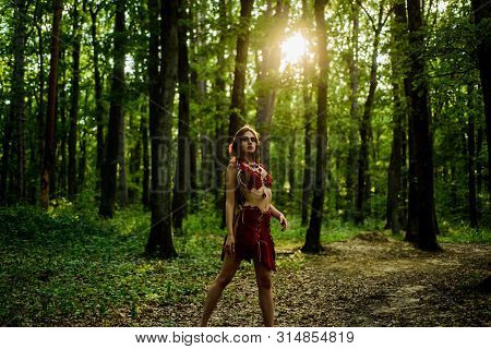 Enjoying Her Beauty. Ethnic Tribal Fashion. Deep Forest. Sexy Girl In Leather Suede Clothes. Cougar 