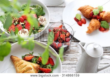 Strawberry Dishes. Puff Pastry With Ricotta, Arugula, Curd And Strawberry Salad, Strawberries In Bal