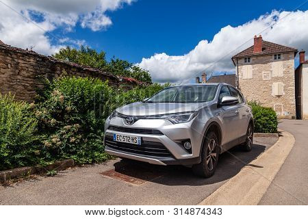France Lyon 2019-06-20 Japanese Gray Car Toyota Rav4 4Wd Crossover Parked On Street Along Road On Co