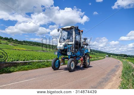 France Lyon 2019-06-20 Winemaking Equipment, Vineyard Harvesting Machine, Blue Tractor Faupin Bobard