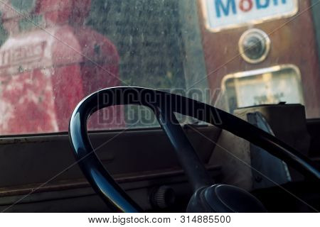 Interior Of Classic Vintage Car -parked Vintage Gas Station. Interior Of An Old Automobile With Stee