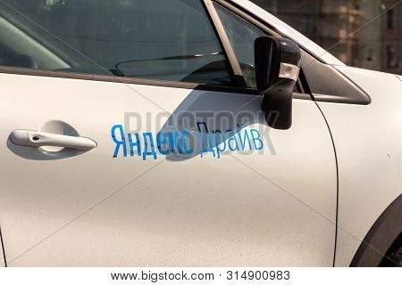 St. Petersburg, Russia - July 22, 2019: Fragment Of Door Of Modern Car With Logo Carsharing Company 