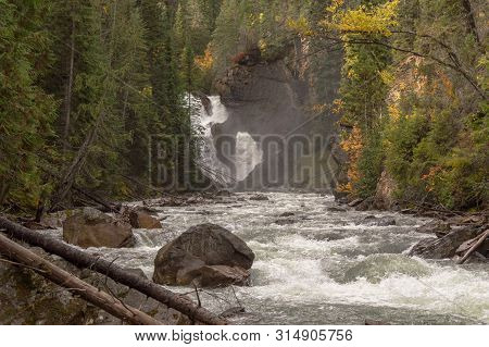 Lower Bugaboo Falls With Lots Of Mist Above The Fast Flowing River Rapids