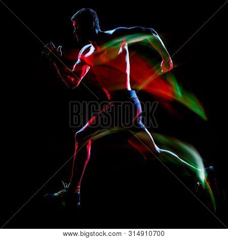 one caucasian topless muscular mature man runner. running jogger jogging isolated on black background with light painting speed mouvement effect