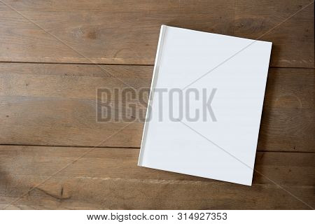 Blank Magazine Or Brochure On Wooden Background Texture, Top View And Space For Text Emplate For You
