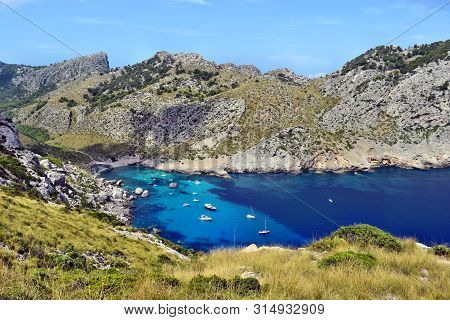Sea Bay With Turquoise Water, Beach And Mountains, Cala Figuera On Cap Formentor