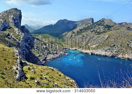 Sea Bay With Turquoise Water, Beach And Mountains, Cala Figuera On Cap Formentor